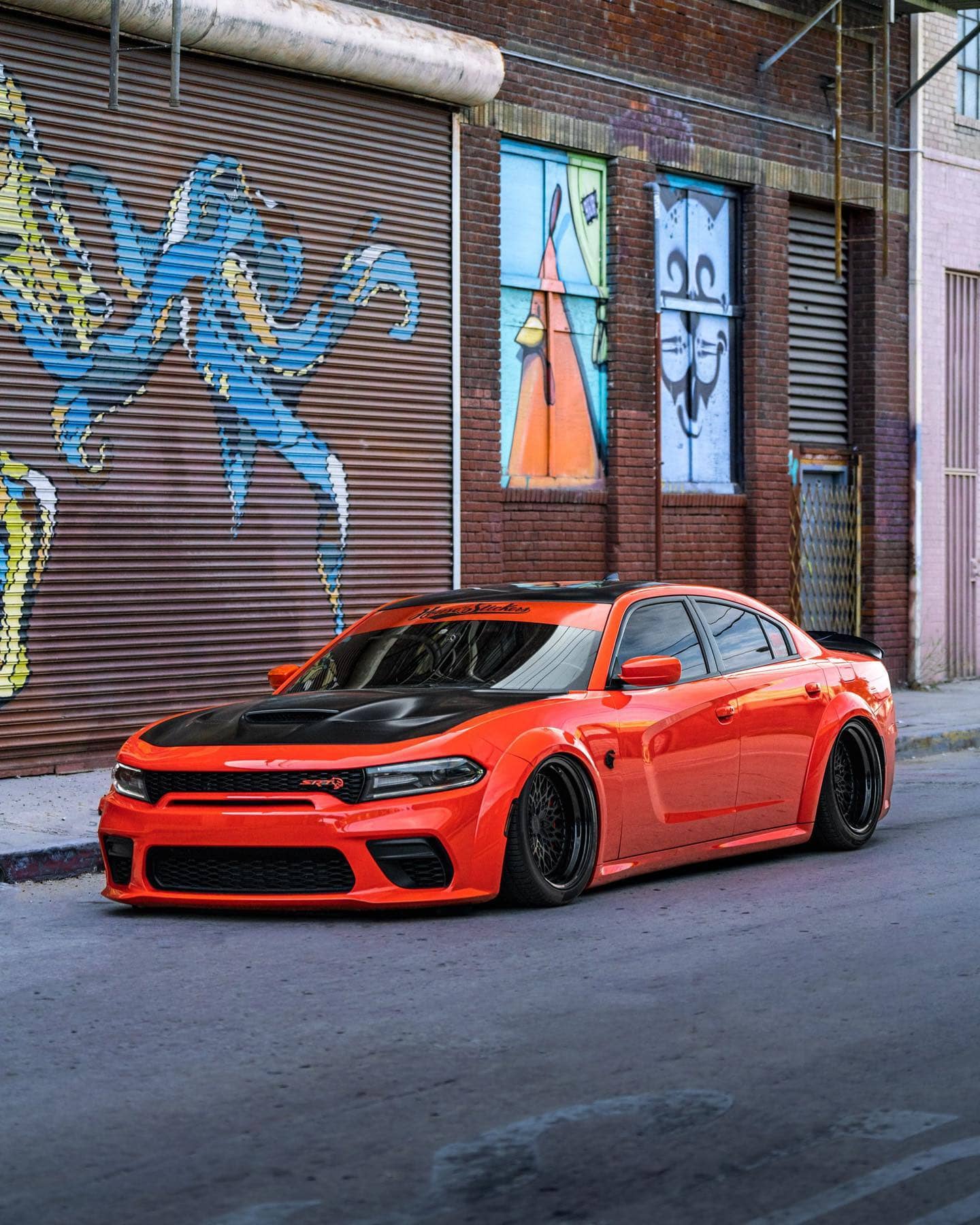 slammed hellcat charger in orange color
