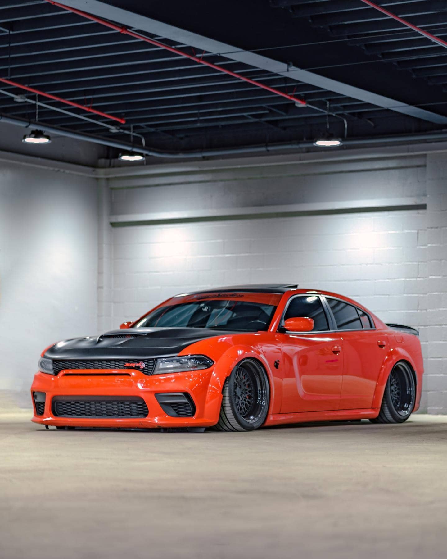 Bagged Charger hellcat on black custom wheels