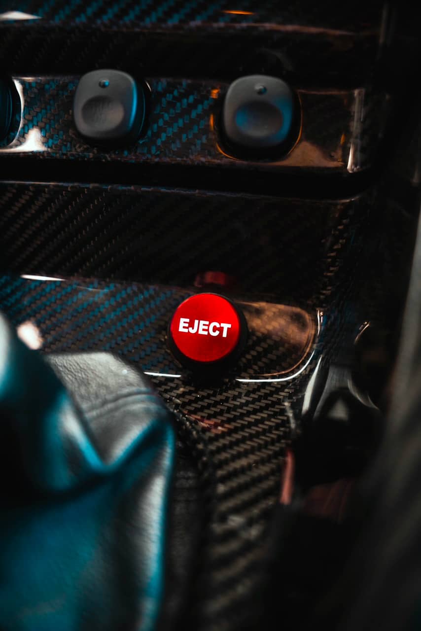 Carbon fiber center console and Eject button by Dark Horse Carbon